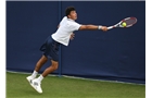 EASTBOURNE, ENGLAND - JUNE 14: Jathan Malik of Great Britain plays a backhand against David Goffin of Belgium during their Men's Singles second round qualifying match on day one of the Aegon International at Devonshire Park on June 14, 2014 in Eastbourne, England.  (Photo by Steve Bardens/Getty Images)